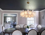 Modern Brass Frosted White Feather Chandelier with Pearl Strand in Luxury Dining Area