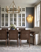 Modern Brass Pearl Oval Art Glass Wall Sconce in Dining Room Setting