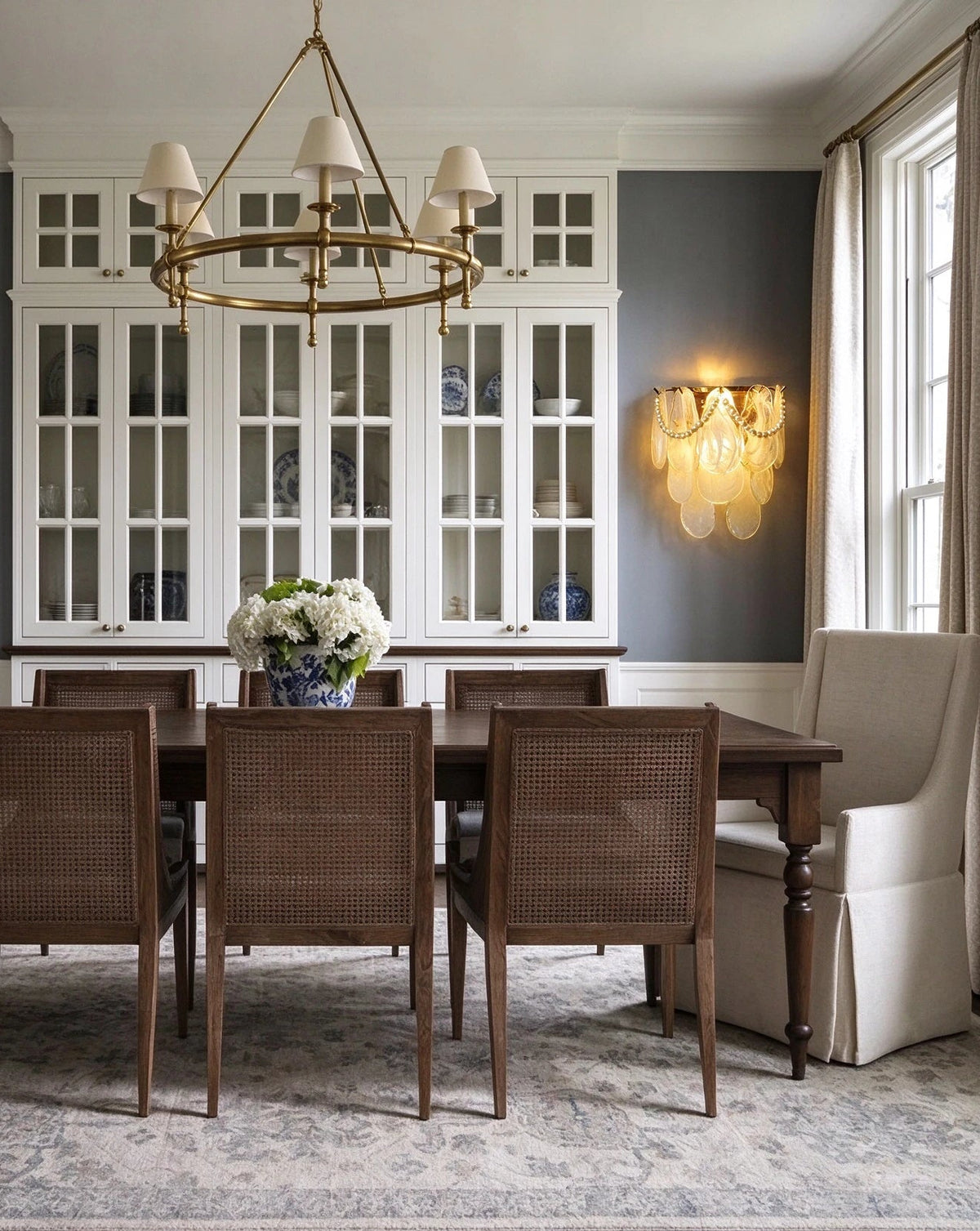 Modern Brass Pearl Oval Art Glass Wall Sconce in Dining Room Setting