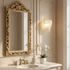 Modern Brass Frosted White Feather Wall Sconce with Pearl Strand Over Bathroom Mirror