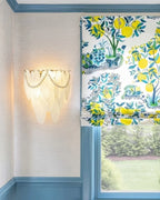 Modern Brass Frosted White Feather Wall Sconce with Pearl Strand in Stylish Sitting Area