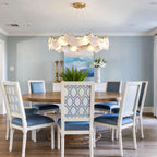 Modern Brass Frosted White Feather Chandelier with Pearl Strand in Elegant Dining Area