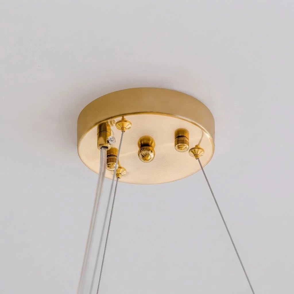Close Up View of Modern Brass Ceiling Canopy and Suspension Wire Connection Details