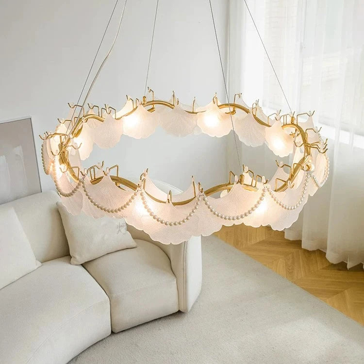 Modern Brass Frosted White Feather Chandelier with Pearl Strand in Master Bedroom Setting