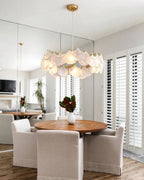 Modern Frosted White Feather Wave Art Glass Chandelier with Pearl Strand Over Round Dining Table