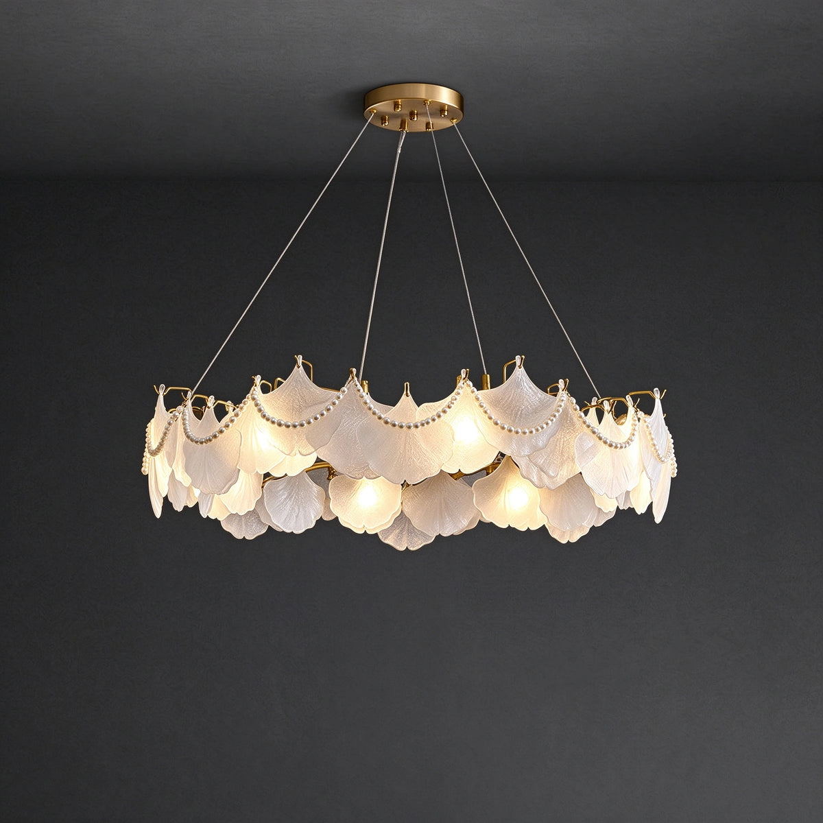 Illuminated Modern Brass Frosted White Feather Chandelier with Pearls Studio Shot on Dark Background