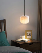 Illuminated Modern Soft Rounded Alabaster Pendant Light Over Nightstand