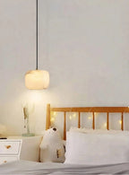 Modern Soft Rounded Alabaster Pendant Light Over Bedroom Nightstand