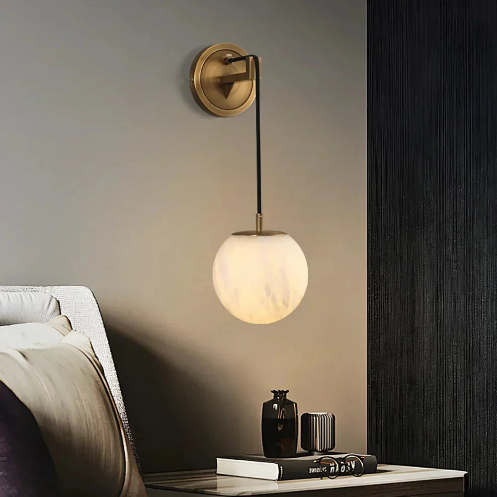 Brass Sphere Alabaster Sconce as Bedside Ambient Lighting
