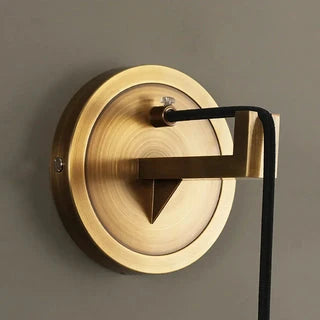 Close Up View of Round Brass Wall Mount Backplate and Downrod