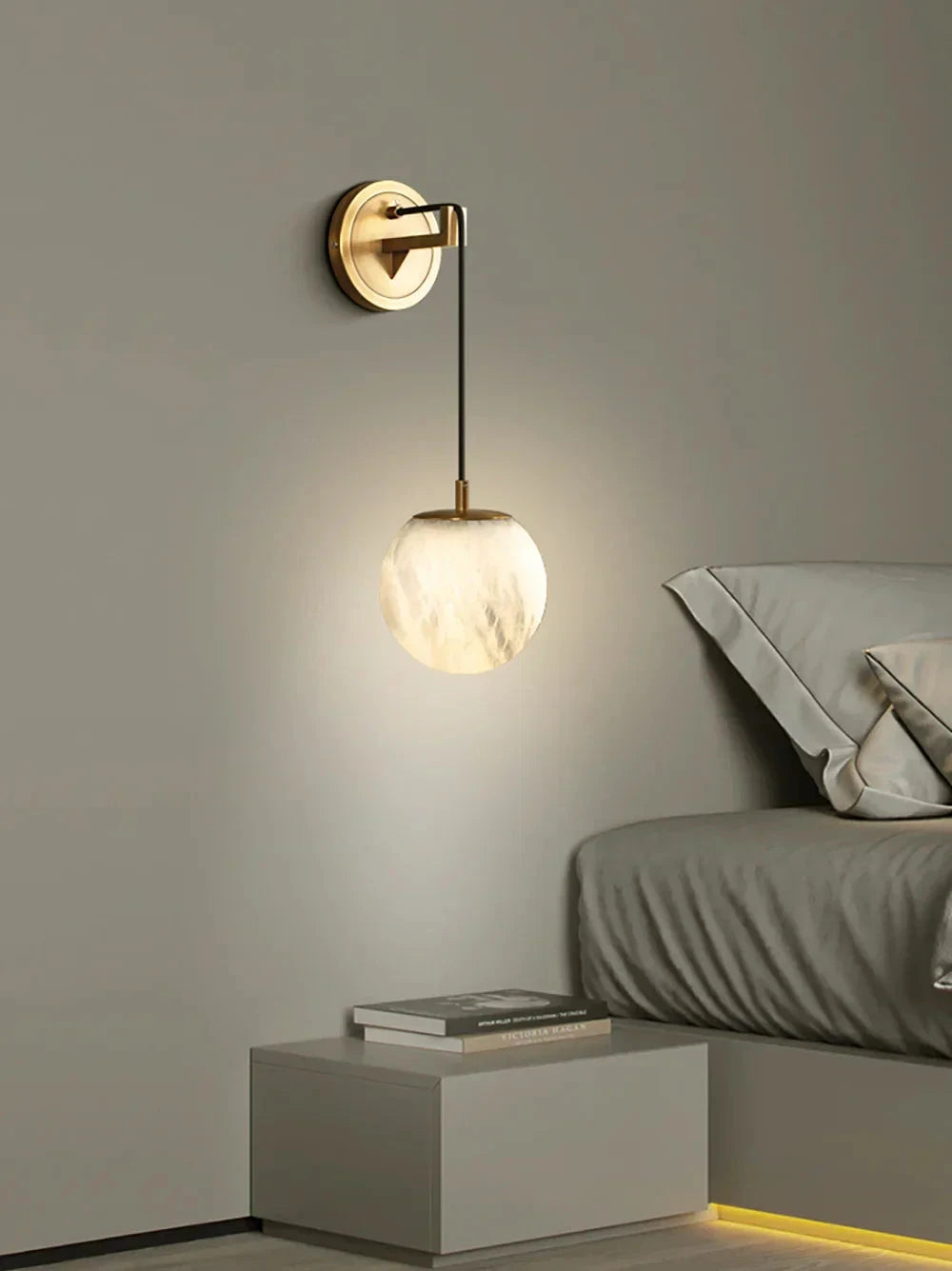 Modern Brass Sphere Alabaster Sconce Beside Bedside Table