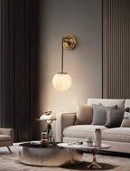 Sphere Alabaster Wall Sconce Illuminating Living Room Area