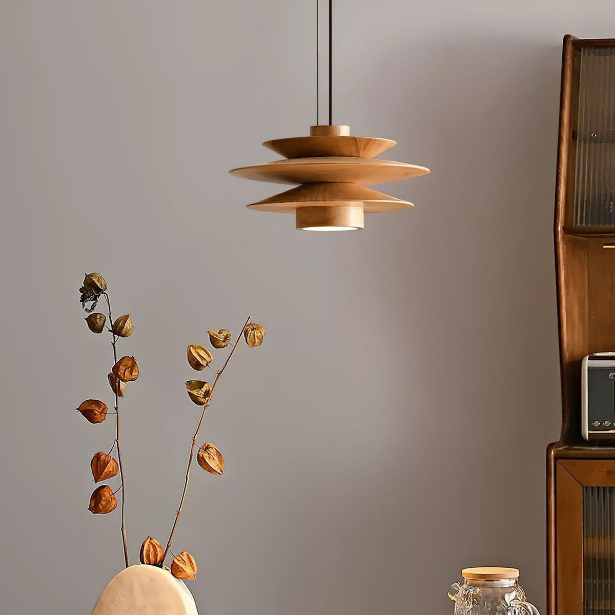 Natural Wood Layered Pendant Light Over Living Room Sideboard