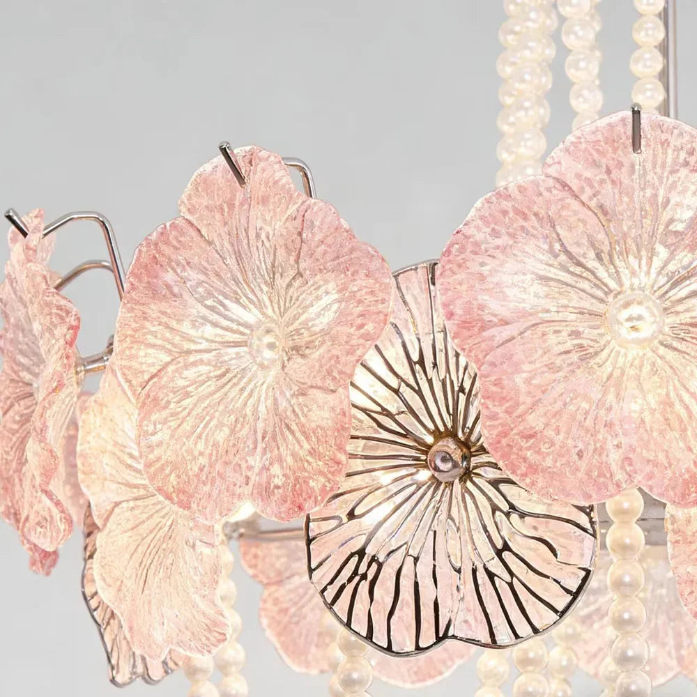 Close Up View of Pink Flower Glass Petals and Butterfly Decor