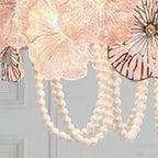 Close Up View of Pearl Beaded Strings and Suspension Details