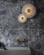 Modern Alabaster Disc Wall Sconces in Luxury Bathroom Setting