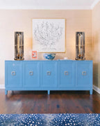 Symmetrical Prism Crystal Column Table Lamps on Blue Credenza