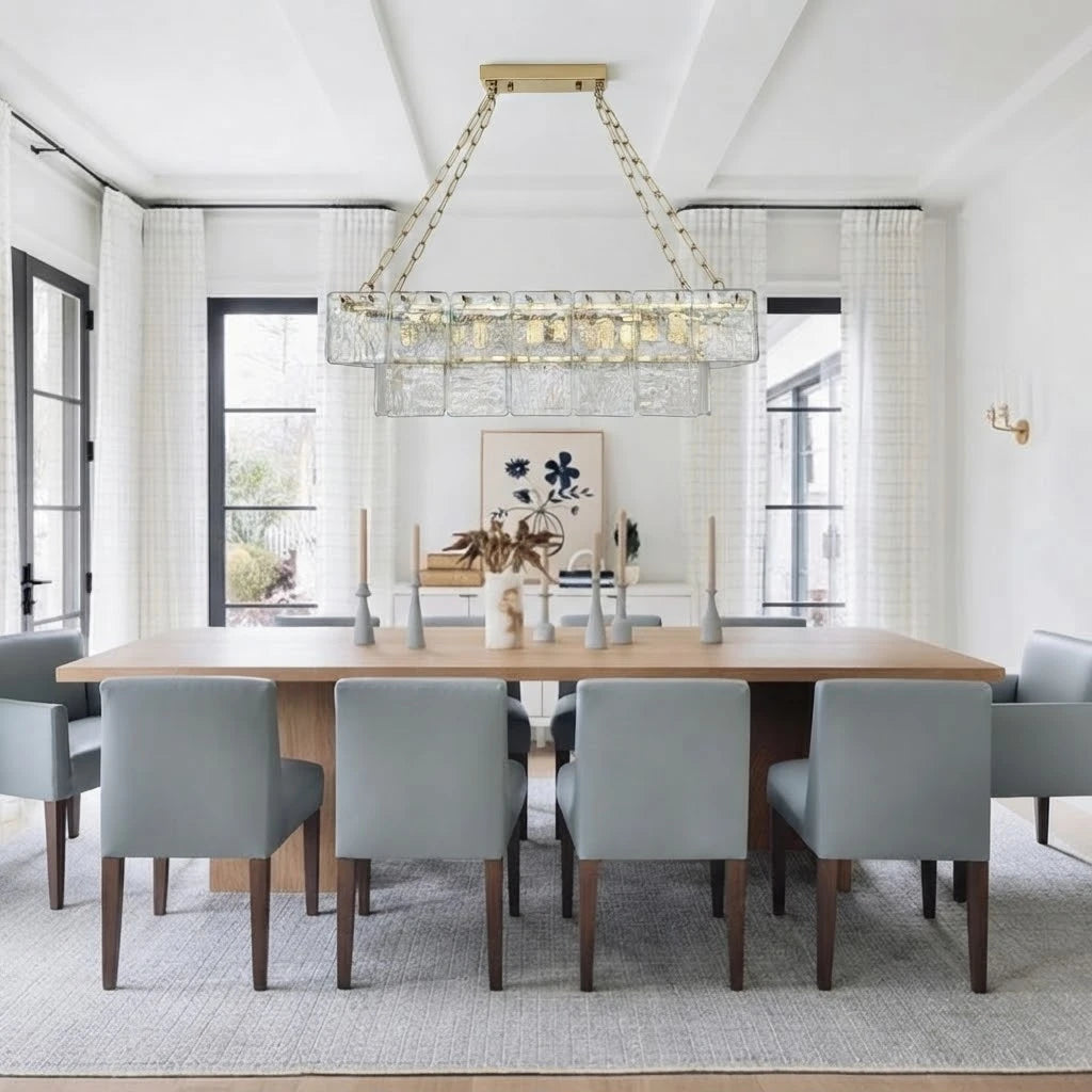 Modern Dining Room with Gray Chairs Installation of Glass Chandelier
