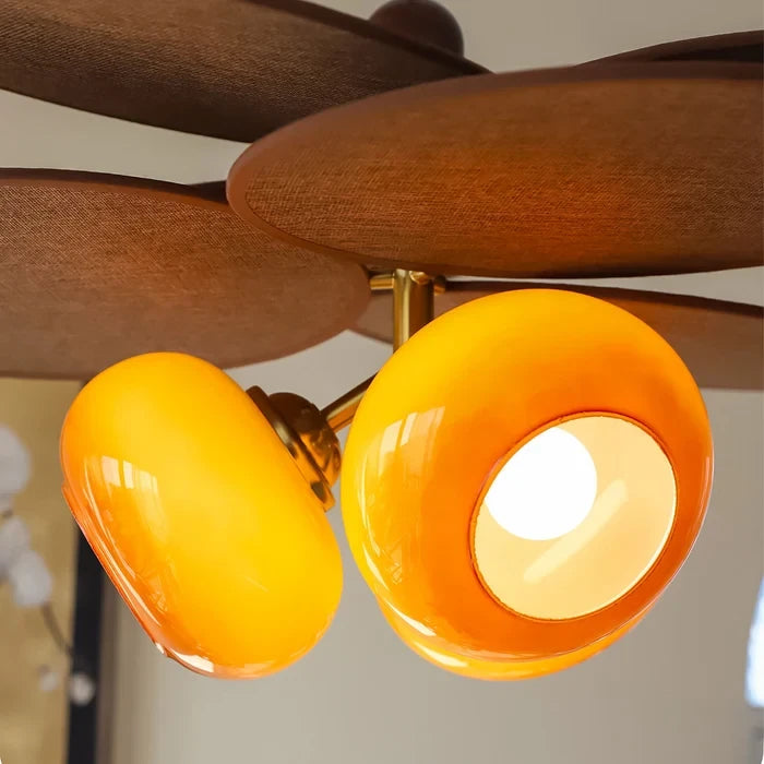 Close Up View of Illuminated Orange Glass Shade and Fixture Details
