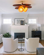 Modern Wood and Glass Ceiling Light Over Living Room Fireplace