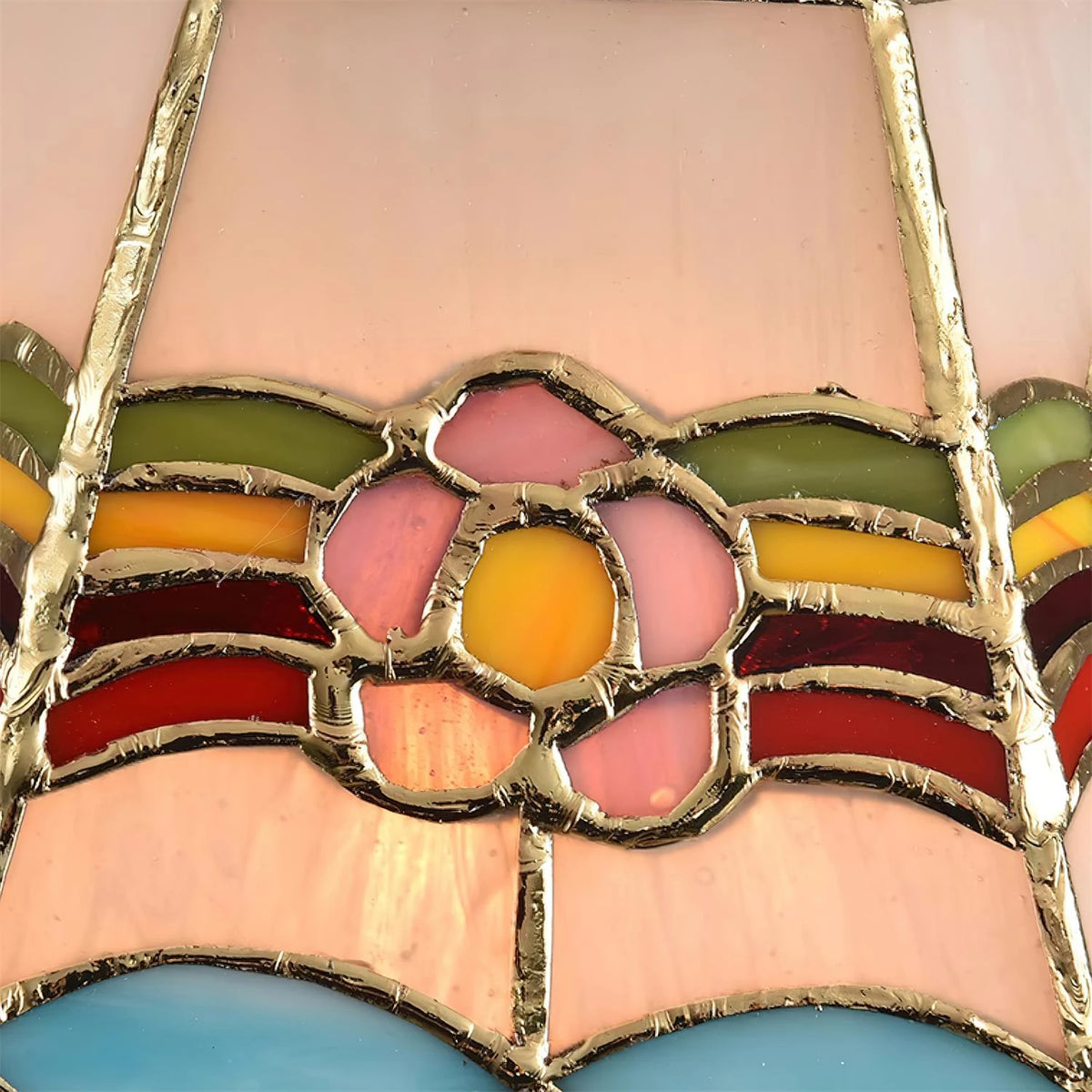 Close Up View of Pink Stained Glass Flower and Rainbow Trim