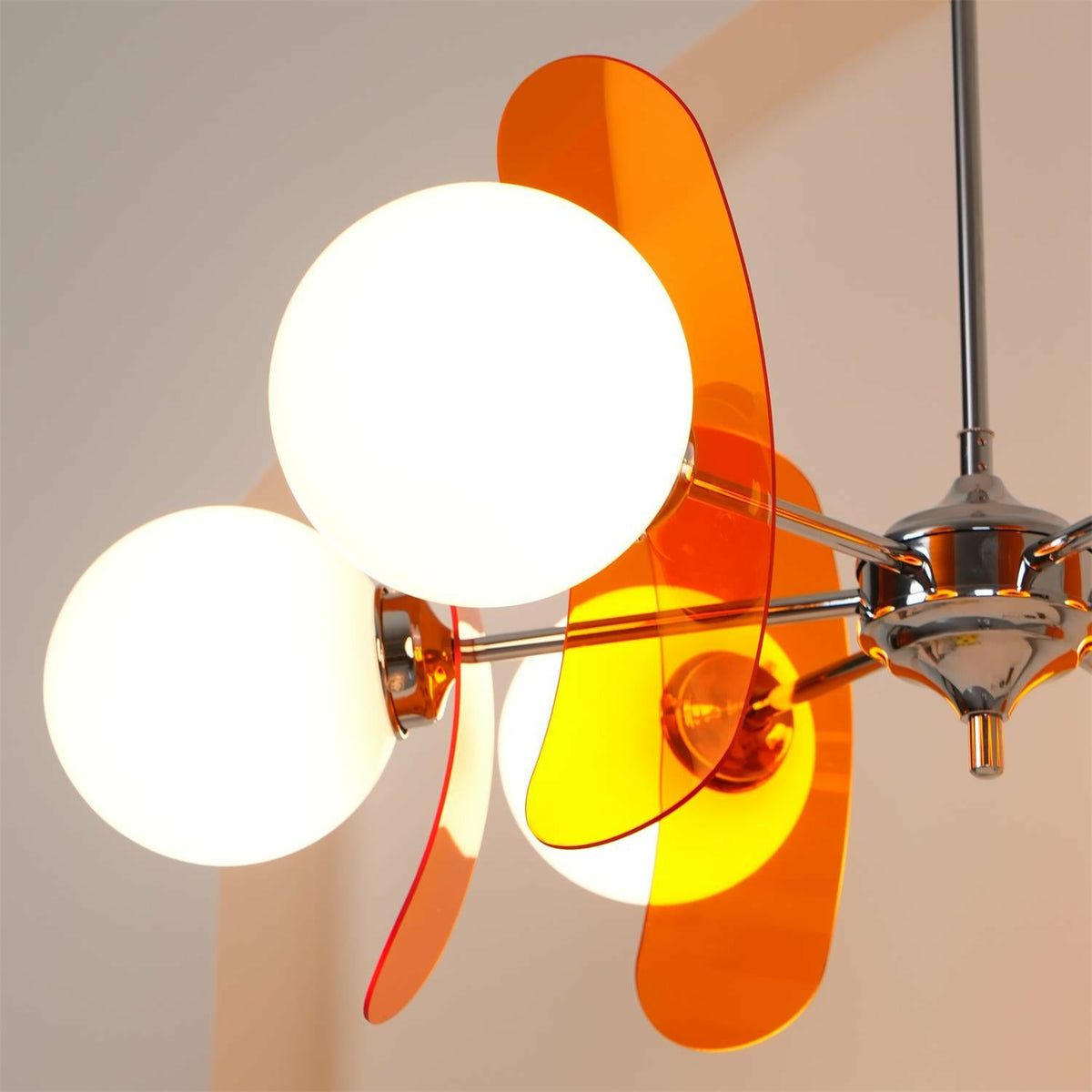 Detail of Opal Glass Globe and Translucent Orange Acrylic Petal