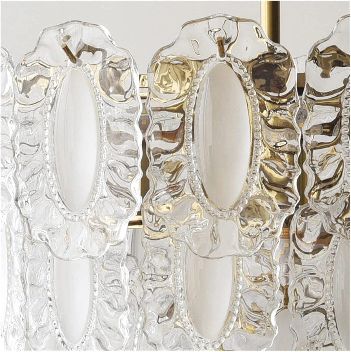 Angled View of Modern Brass Oval Art Glass Semi-Flush Mount Chandelier Studio Display
