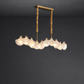 Illuminated Modern Brass Wave Art Glass Linear Chandelier with Pearl Strand Studio Shot on Dark Background