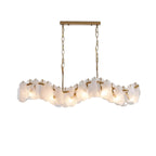 Modern Brass and Feather Wave Art Glass Linear Chandelier with Gold Canopy on Pure White Background