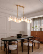 Modern Feather Wave Art Glass Linear Chandelier in Minimalist Dining Room