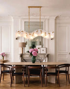 Modern Brass Feather Wave Art Glass Linear Chandelier in Elegant Dining Area