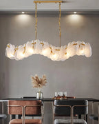 Modern Brass Feather Wave Art Glass Linear Chandelier in Cozy Dining Space