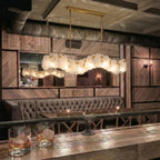 Modern Brass Wave Art Glass Linear Chandelier in Retro Lounge Bar Setting