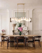 Modern Brass Wave Art Glass Linear Chandelier in Formal Dining Room