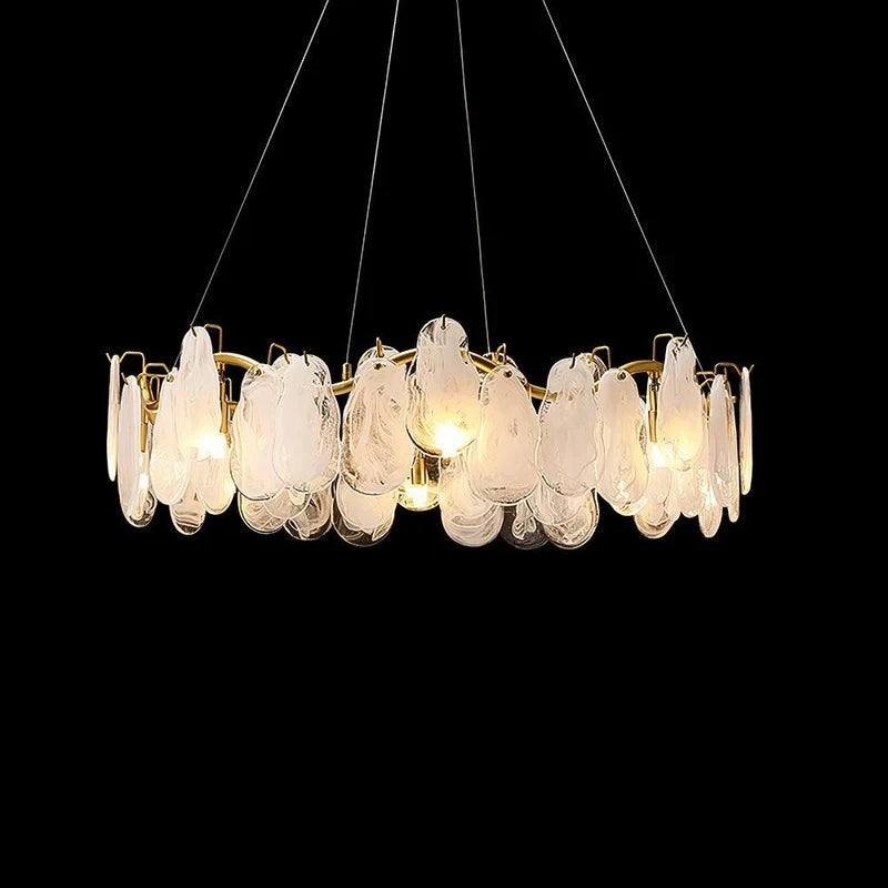 Illuminated Modern Brass Feather Wave Chandelier Studio Display on Black Background
