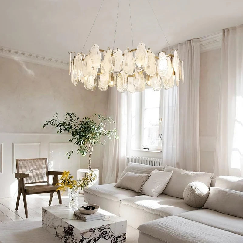 Modern Brass Feather Wave Chandelier in Bright Living Space