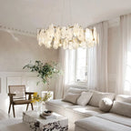 Modern Brass Feather Wave Chandelier in Bright Living Space