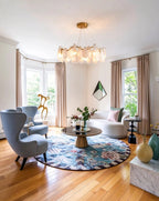 Modern Brass Feather Wave Chandelier in Nordic Living Room Setting