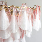 Close Up View of Multi-Tier Pink Petals and Brass Hardware Structure
