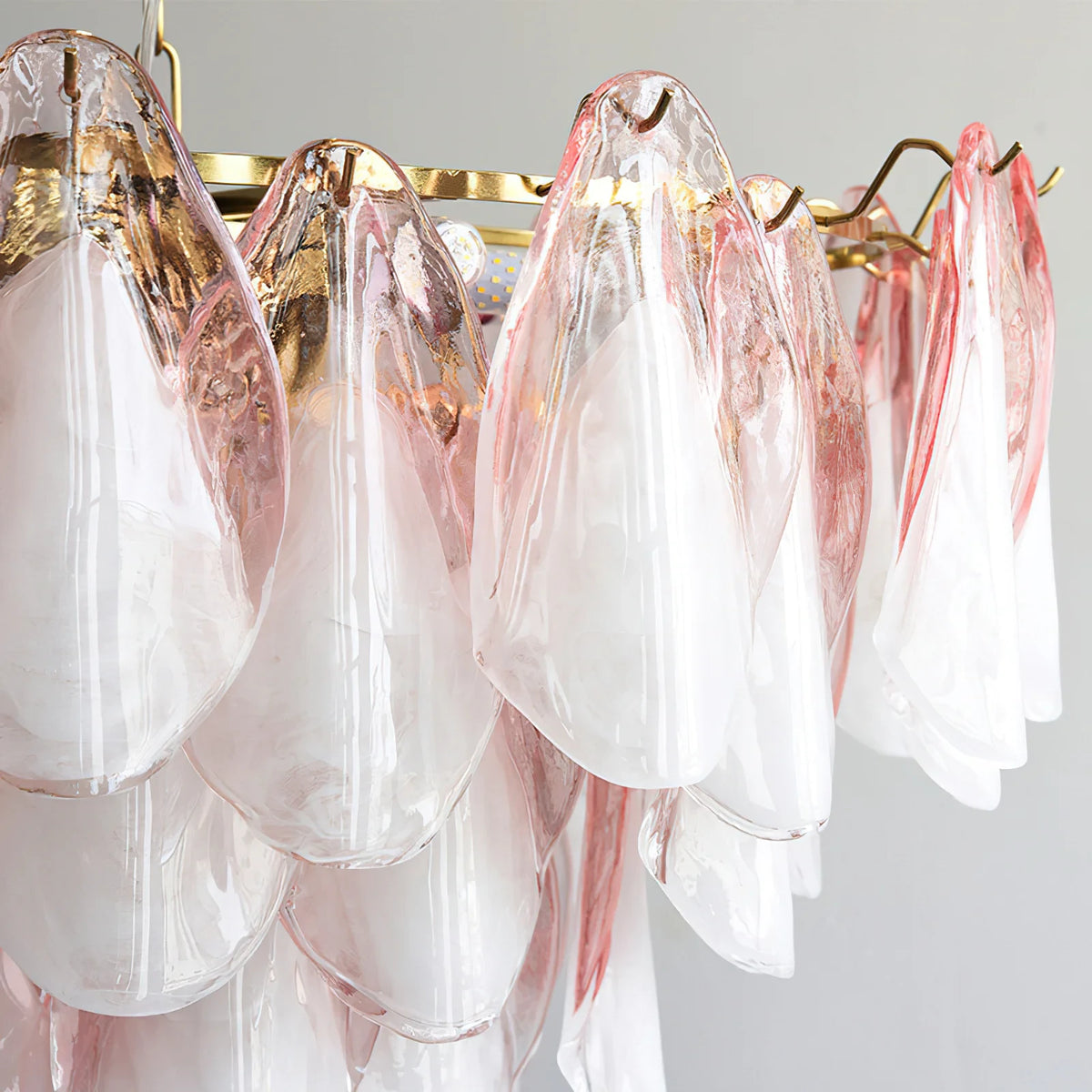 Close Up View of Multi-Tier Pink Petals and Brass Hardware Structure