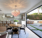 Modern Pink Pearl Petal Chandelier Over Dining Room Table