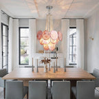 Modern Pink Disc Chandelier Over Long Dining Table