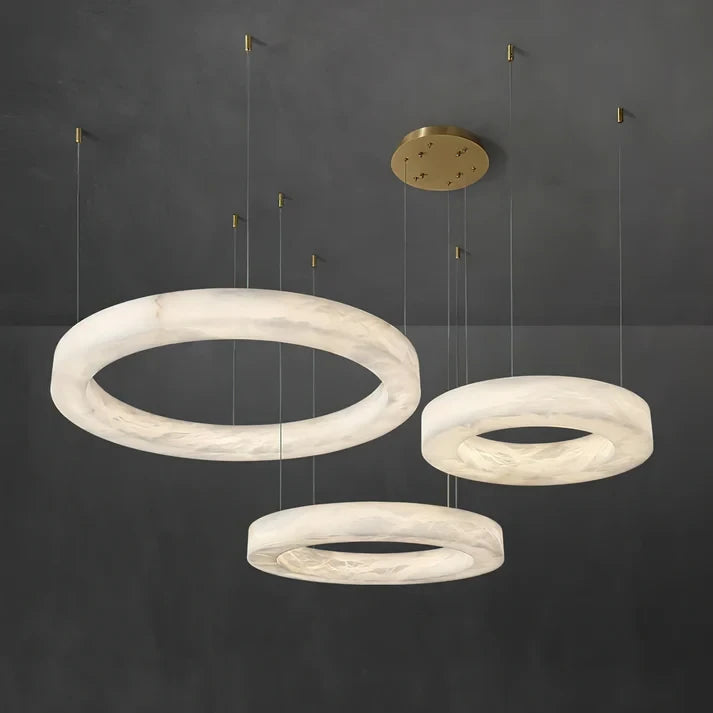 Dark Room View of Illuminated Alabaster Multi-Ring Chandelier
