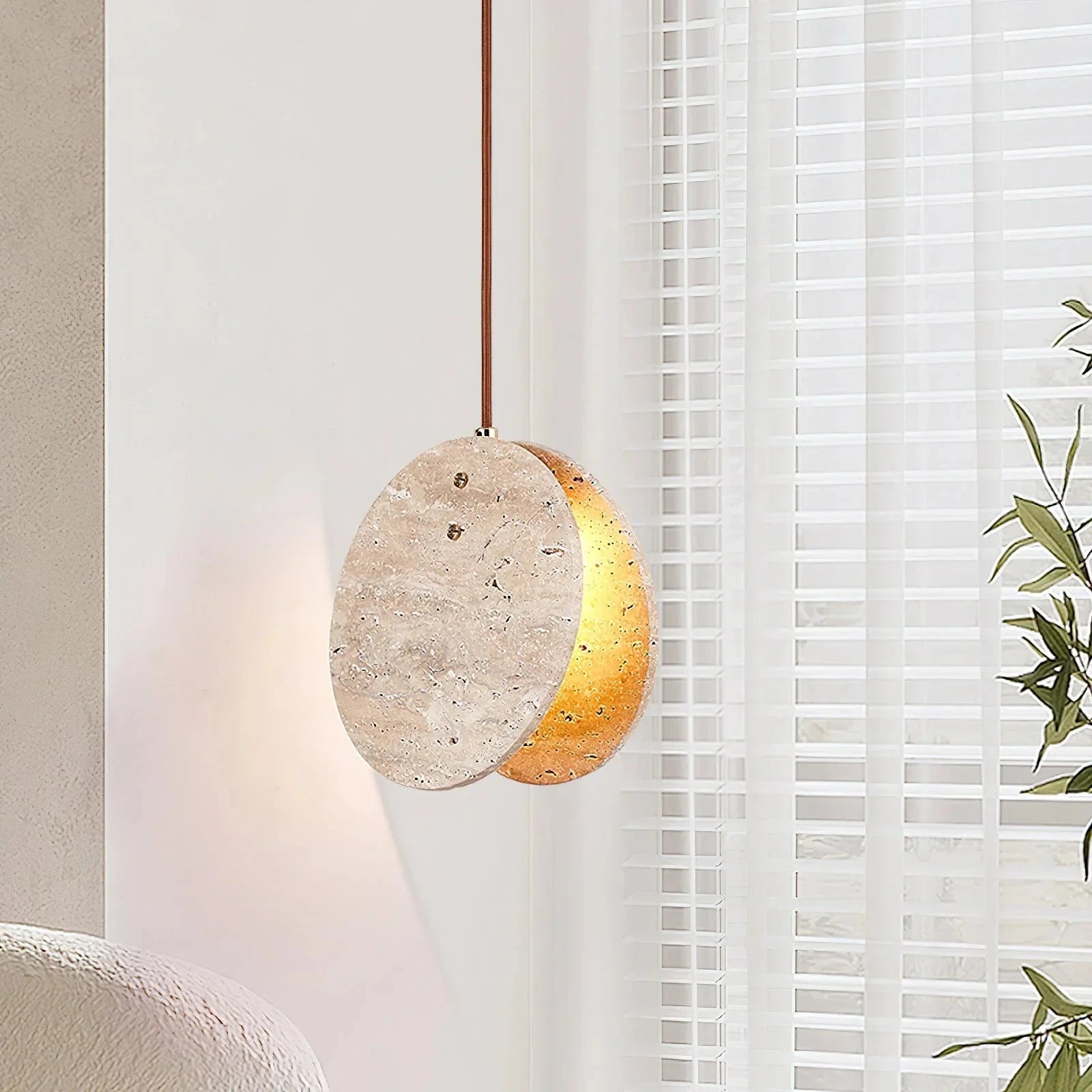 Japandi Travertine Pendant Light Over Living Room Seating Area