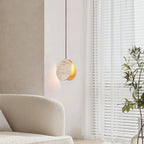 Travertine Disc Pendant Light Over Living Room Sofa