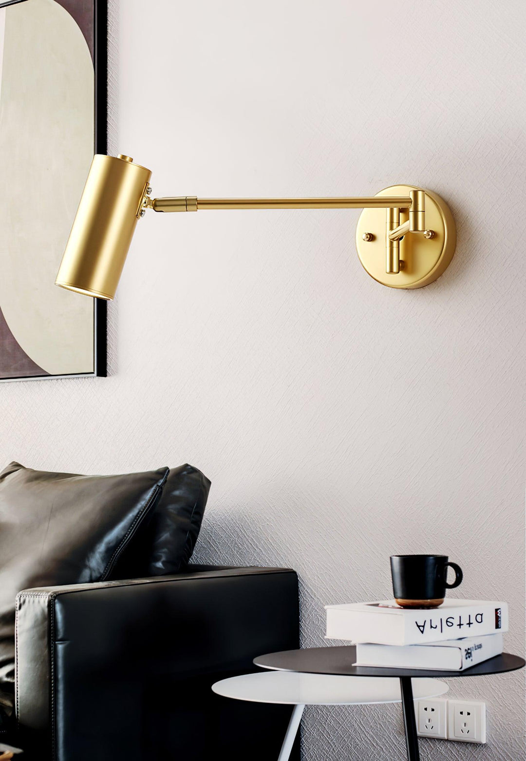 Brass Swing Arm Wall Sconce Over Living Room Seating Area