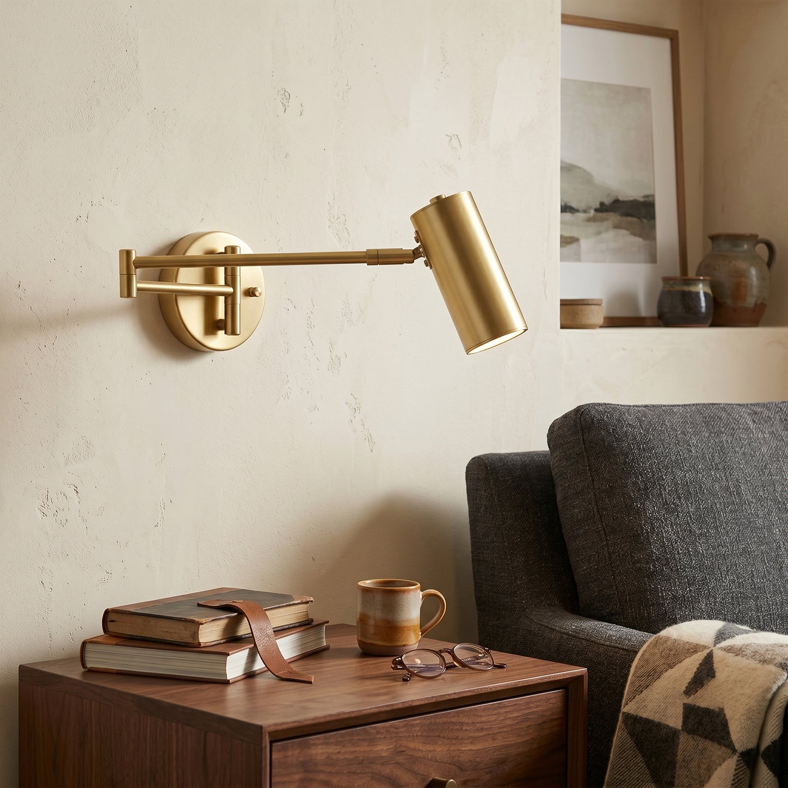 Brass Swing Arm Wall Sconce Over Living Room Sofa