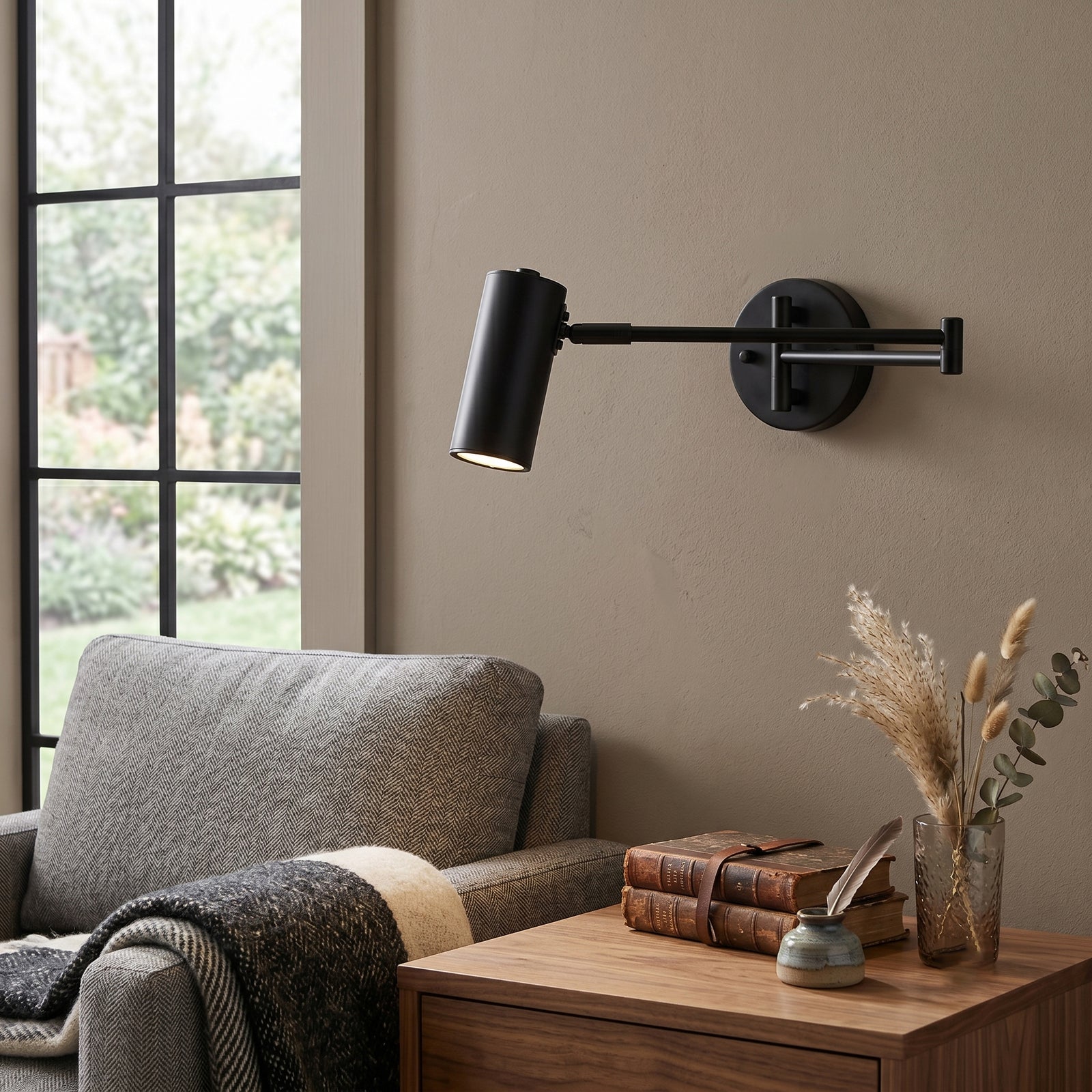Black Swing Arm Adjustable Wall Light Over Living Room Side Table