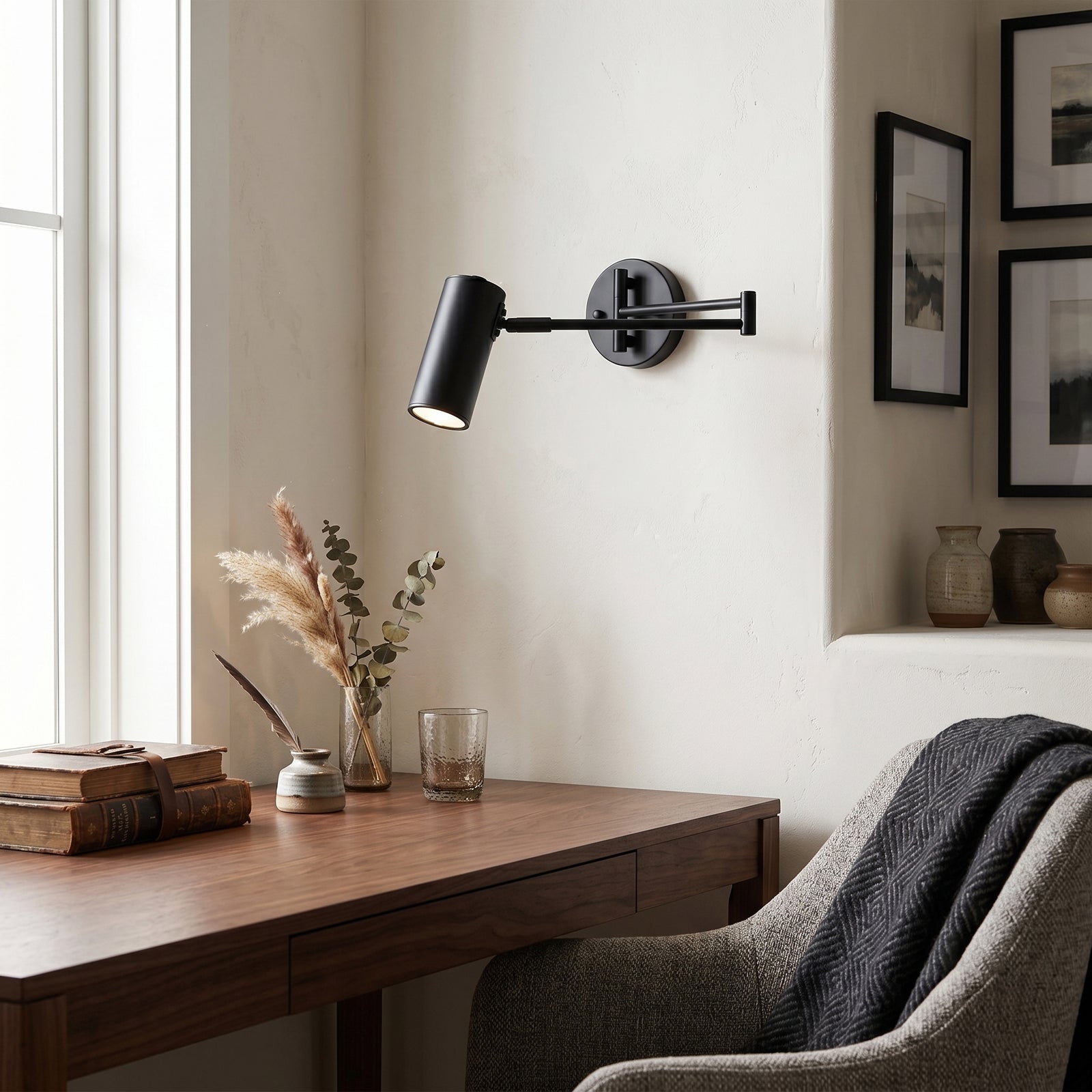 Modern Black Swing Arm Wall Sconce Over Home Office Desk