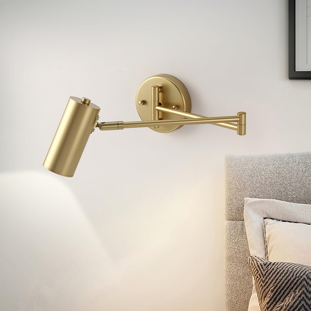 Illuminated Brass Swing Arm Wall Light Over Bedroom Bed